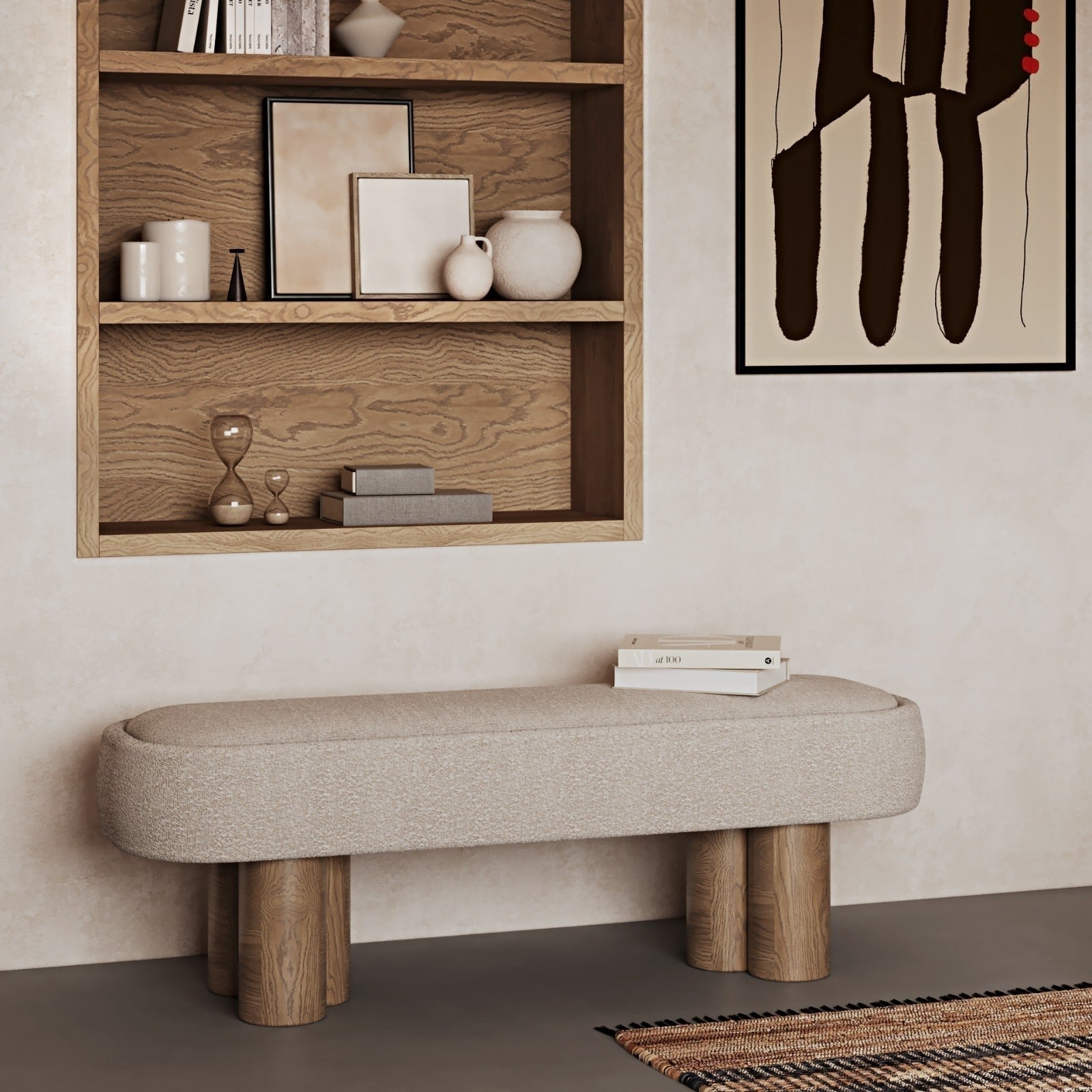 75-inch natural boucle upholstered end-of-bed bench with rounded edges and cylindrical solid wood legs, styled with stacked books under a built-in wood shelf and abstract wall art.