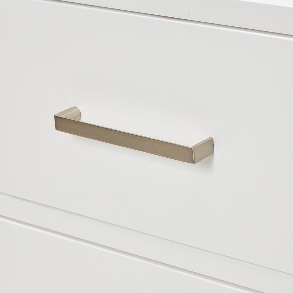 Close-up of a brushed nickel rectangular drawer pull mounted on a stone-finish modern solid wood bathroom vanity drawer.