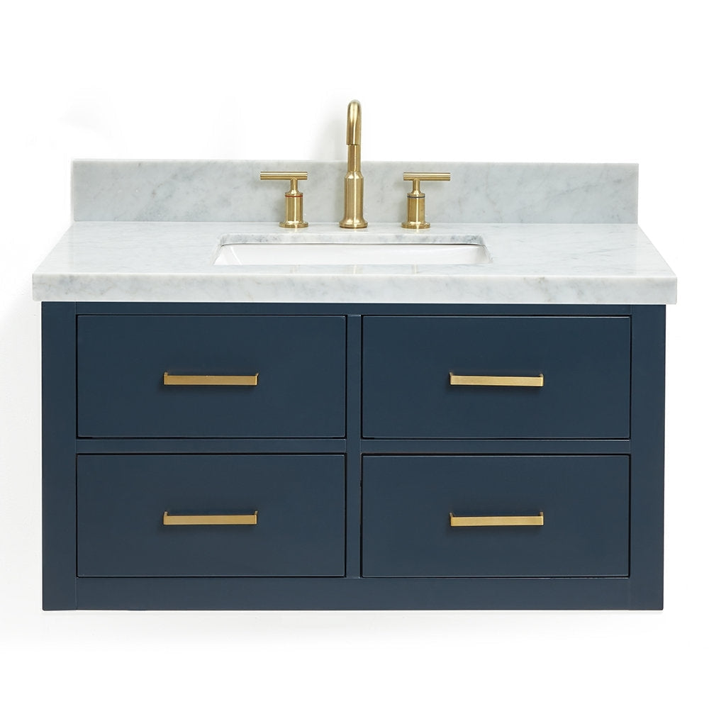 37-inch solid wood bathroom vanity in navy with a stone marble top, integrated rectangular undermount sink, central brass faucet and matching brass drawer pulls on four drawers.