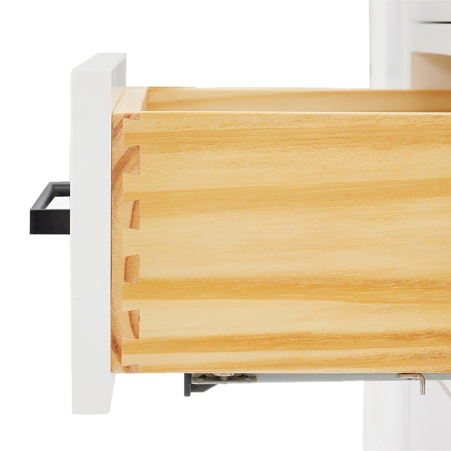 Close-up of a solid wood vanity drawer showing dovetail joints and natural wood grain, with a white-painted front panel, black rectangular handle and visible metal soft-close drawer slide.