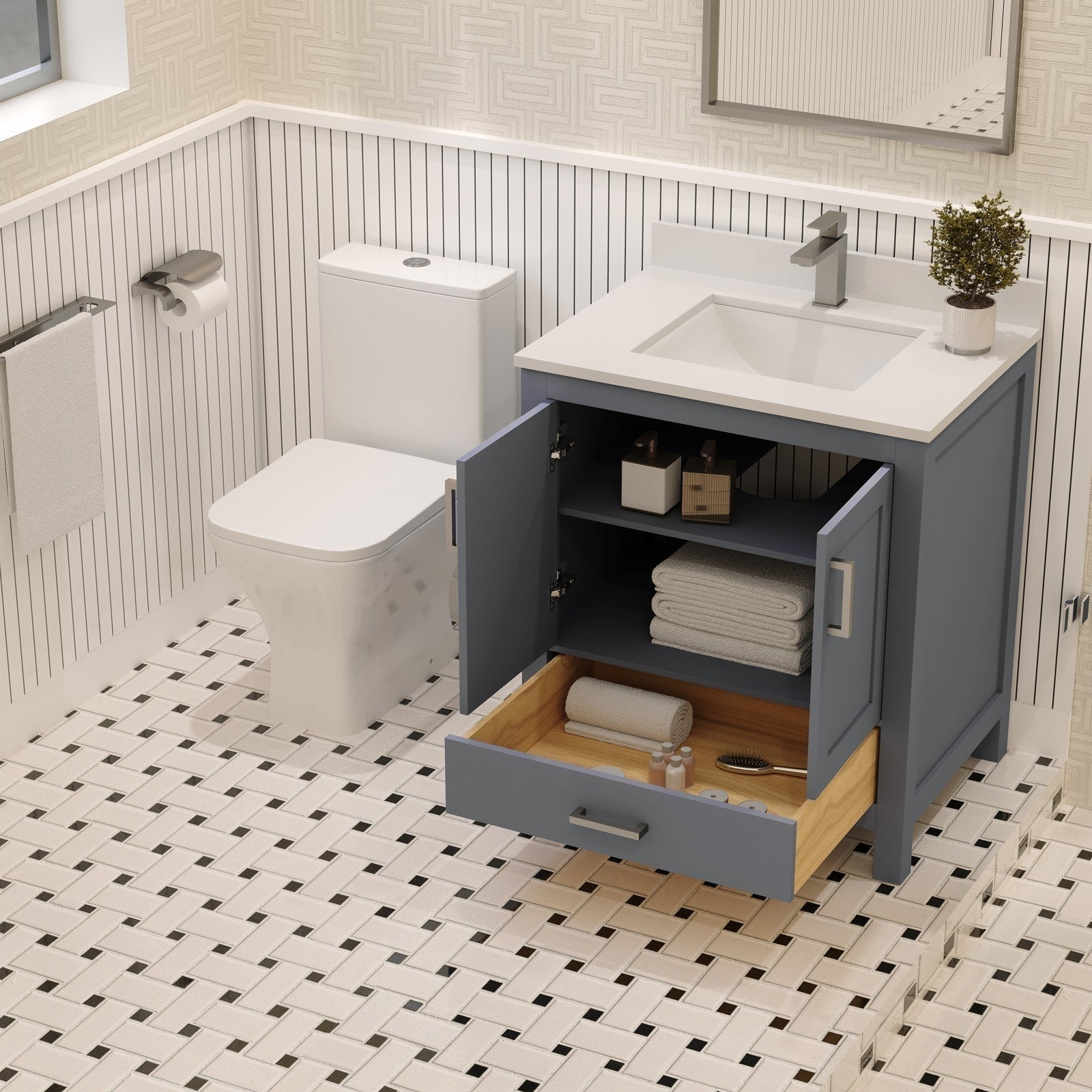 Modern 30-inch freestanding solid wood bathroom vanity in a gray-blue finish with a white stone countertop and integrated sink; open cabinet and wood-lined bottom drawer holding folded towels and toiletries beside a toilet.