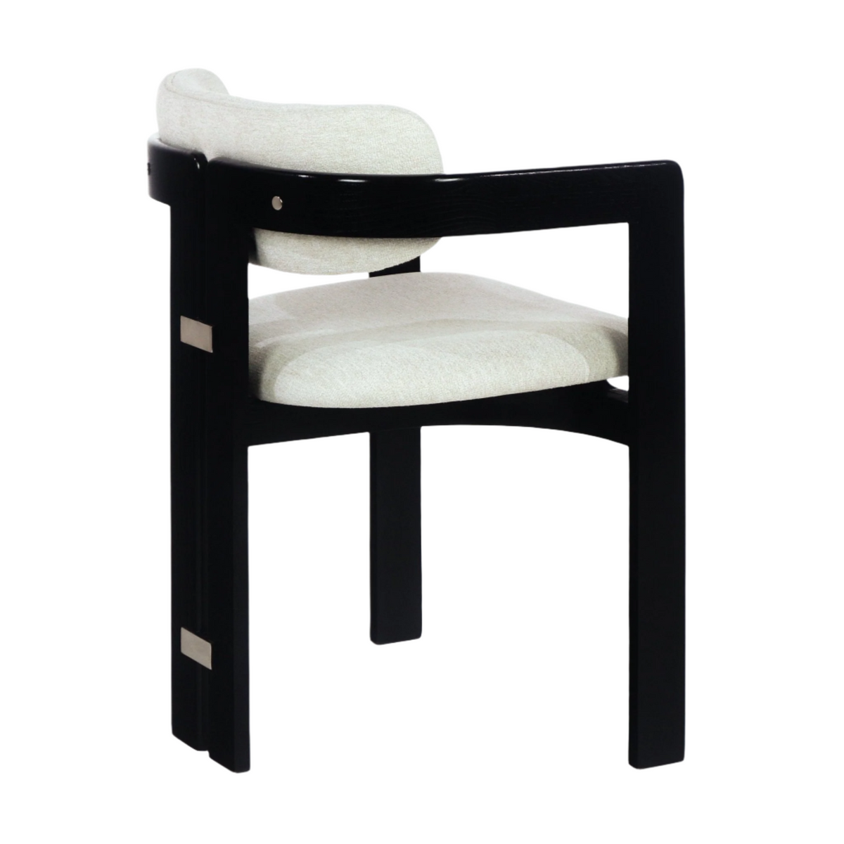 Three-quarter view of a modern dining chair with a black wood frame, curved armback and beige boucle upholstered seat and back cushion, accented with stainless-steel rectangular plates.