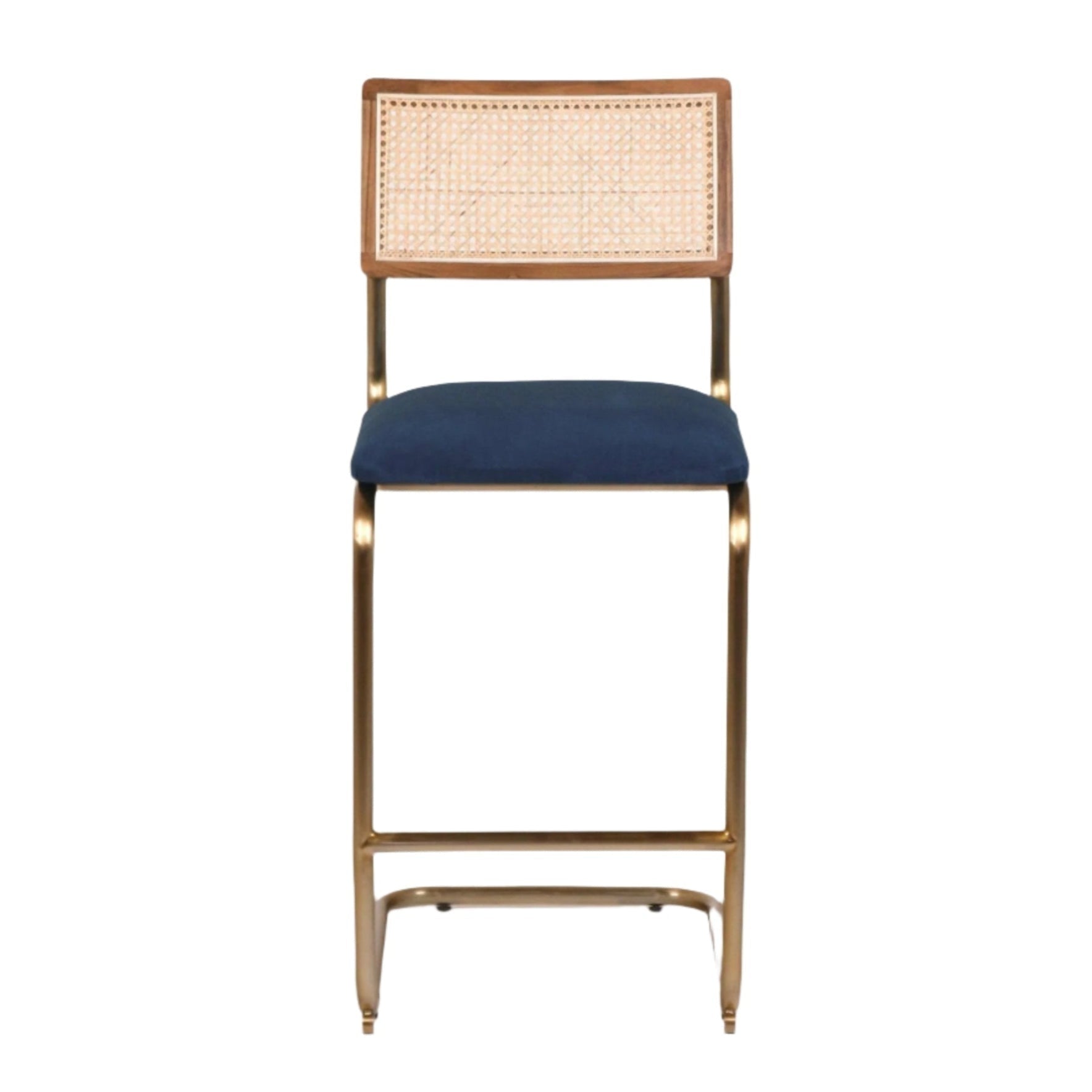 Front view of a cantilever bar stool with a navy velvet upholstered seat, natural woven cane back in a wood frame, and a gold-brass metal cantilever base with integrated footrest.