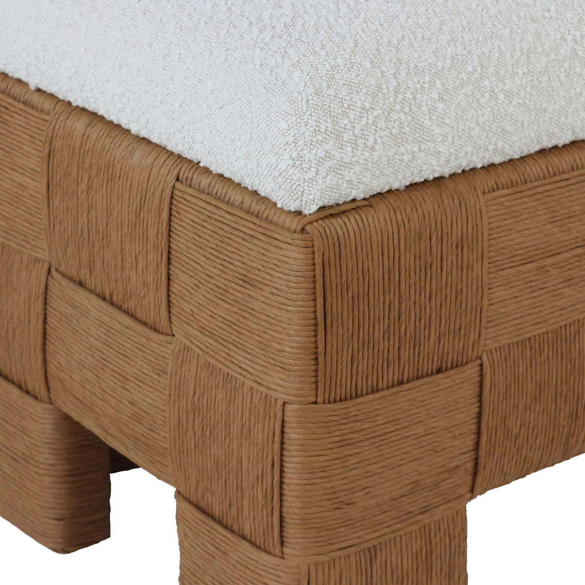 59-inch boucle upholstered bench with a cream fabric cushion set on a woven natural rattan checkerboard base and short rattan feet, low-profile boho-contemporary end-of-bed or entryway bench.