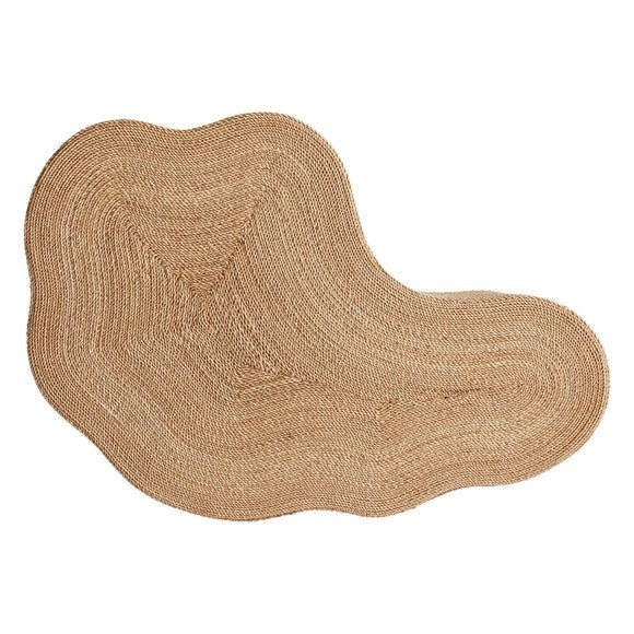 Top-down view of an irregular organic-shaped coffee table top woven from natural abaca rope in warm beige, showing concentric braided texture and soft undulating edges.