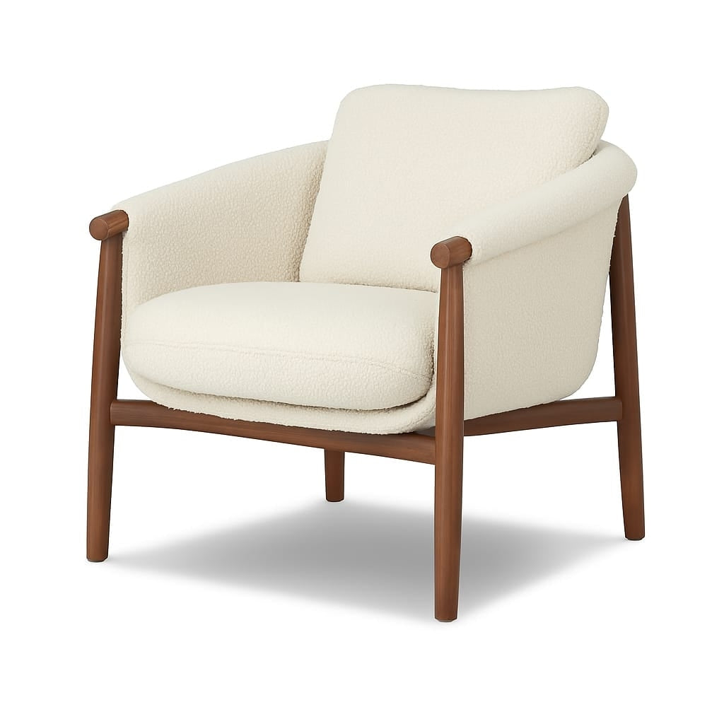 Beige boucle-upholstered accent chair with a plush seat and sloped back, wrapped arms and a natural wood frame with tapered legs in a mid-century modern silhouette.