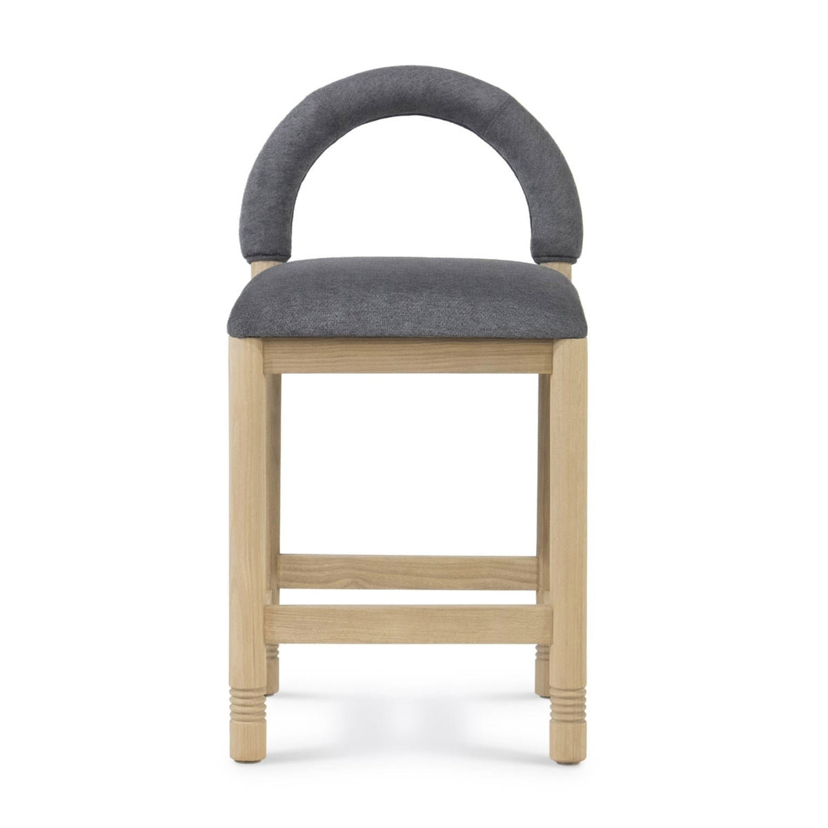 Front view of a counter stool with natural oak frame, cushioned dark gray boucle seat and rounded low back, photographed against a white background.