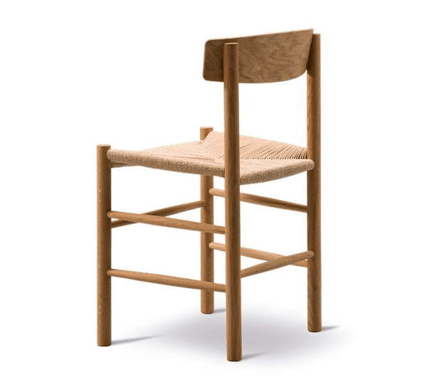 Armless mid-century modern dining chair with a solid teak frame, natural woven papercord seat and curved teak backrest, shown on a white background.