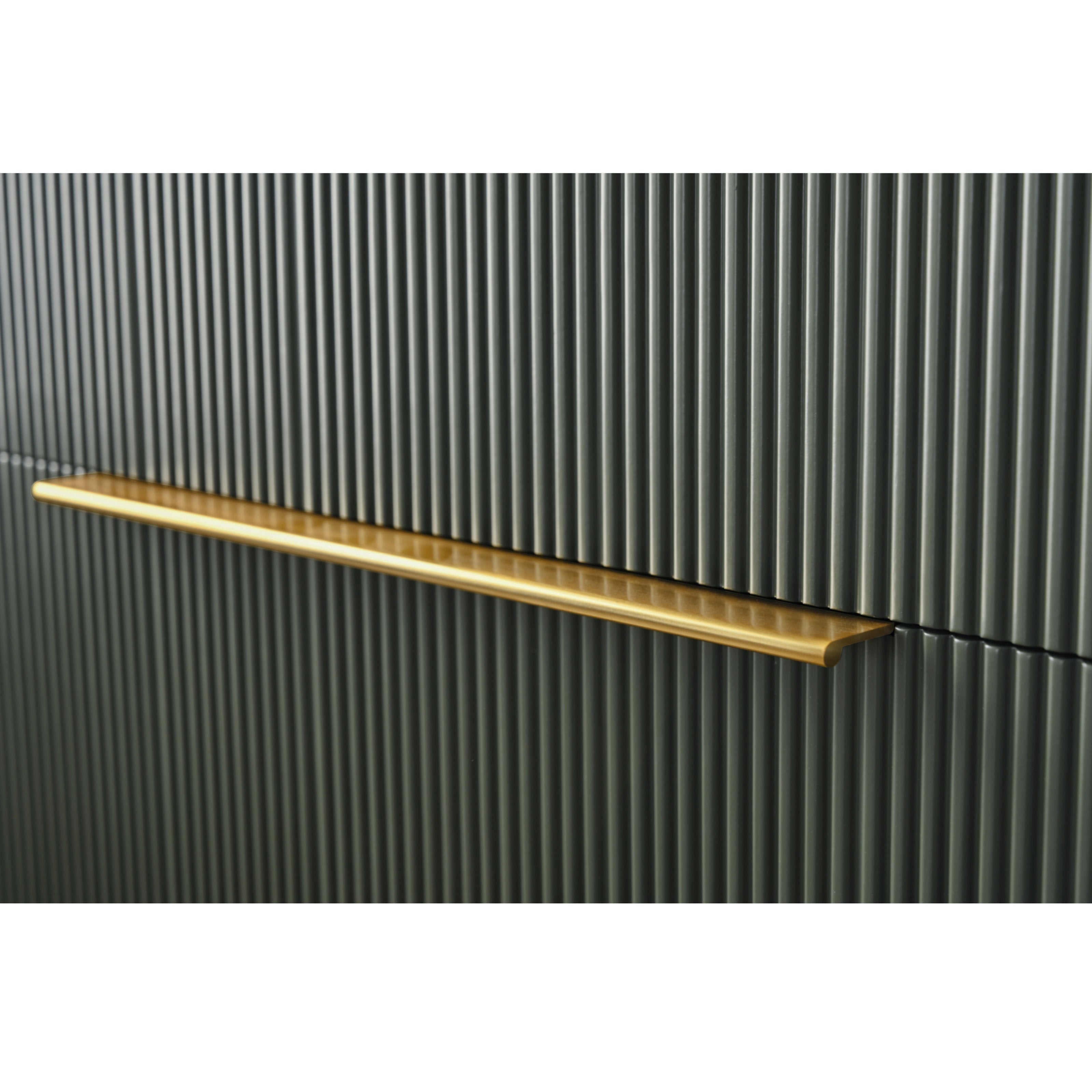 Close-up of a stone-colored fluted vanity drawer front with a long brushed-brass bar handle mounted horizontally, highlighting the modern ribbed texture and slim metallic pull.