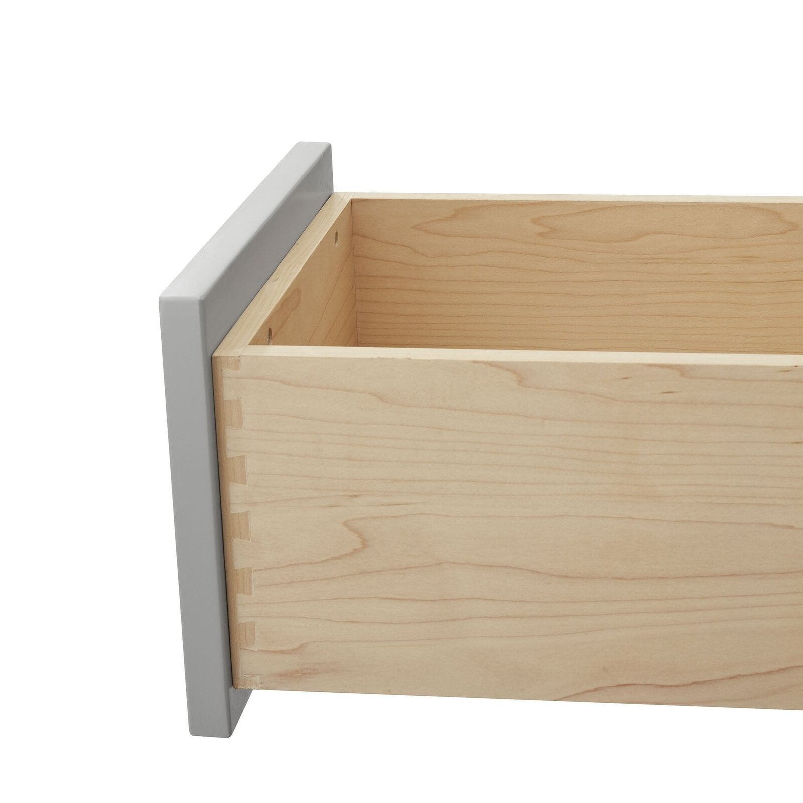 Close-up of a solid wood vanity drawer in a natural maple finish showing dovetail joinery and the stone-colored outer frame, highlighting the drawer interior and side construction.