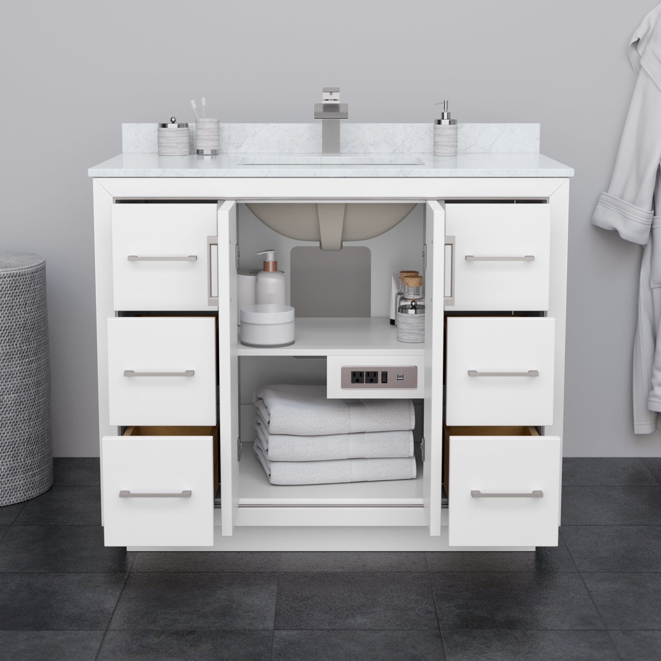 Front view of a 42-inch modern white solid wood bathroom vanity with a stone top and single integrated sink, six drawers flanking an open center cabinet with folded towels and a built-in outlet, brushed-nickel handles.