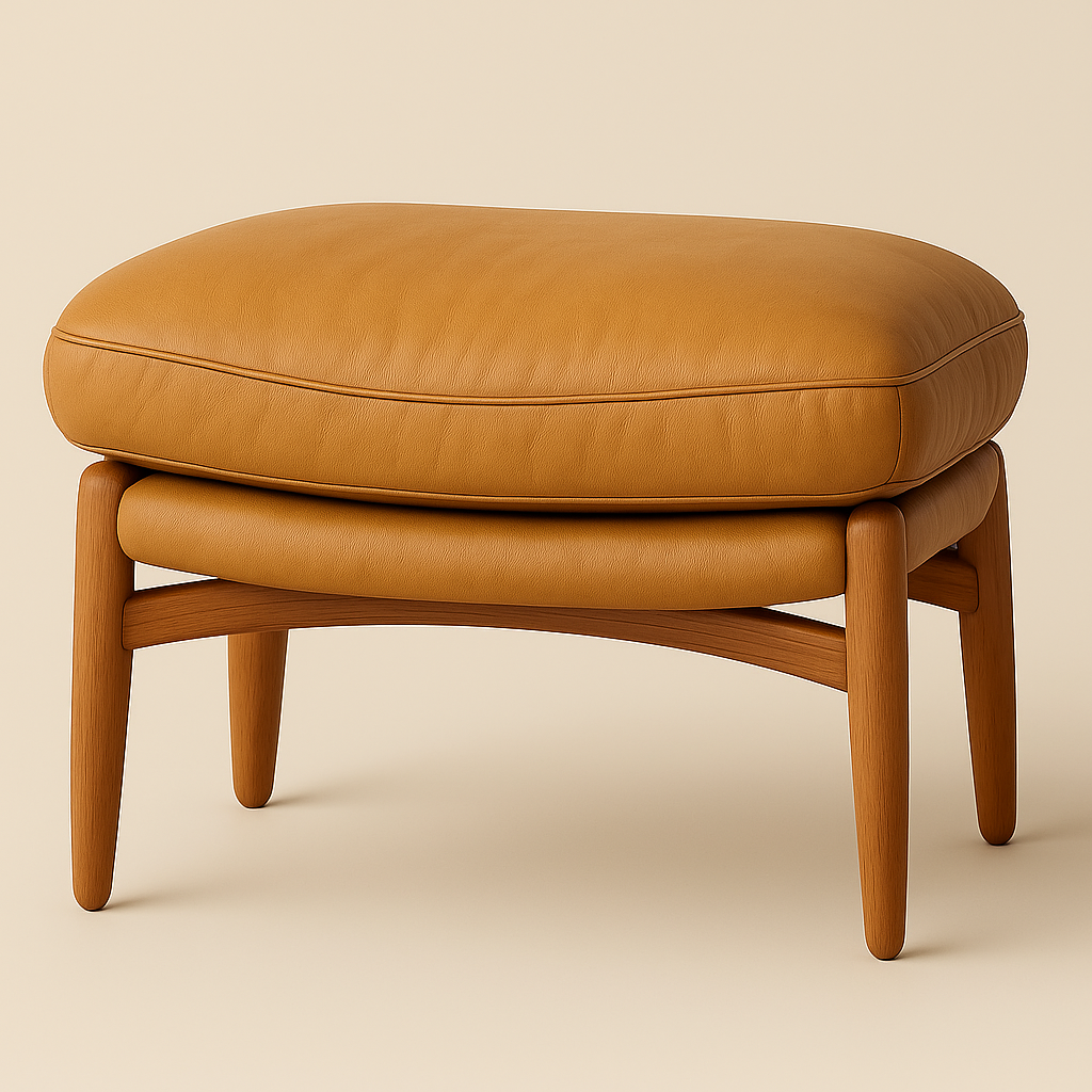 Beige faux leather ottoman with a plush piped cushion resting on a solid wood frame with rounded, tapered legs, shown against a neutral background.