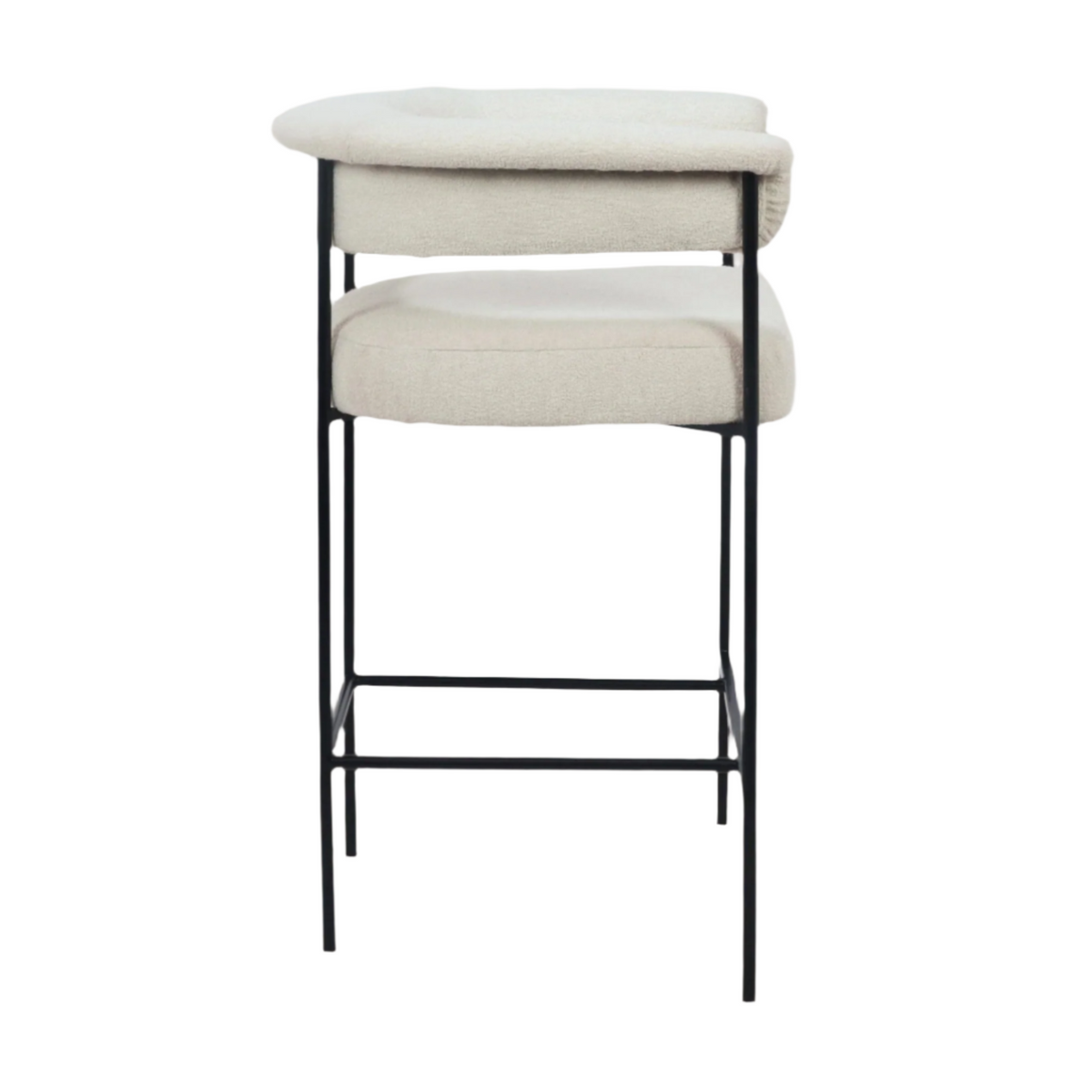 Cream boucle upholstered counter stool with a low rounded back and padded seat, supported by a slim matte black metal frame with integrated footrest, shown on a white background in a modern minimalist style.