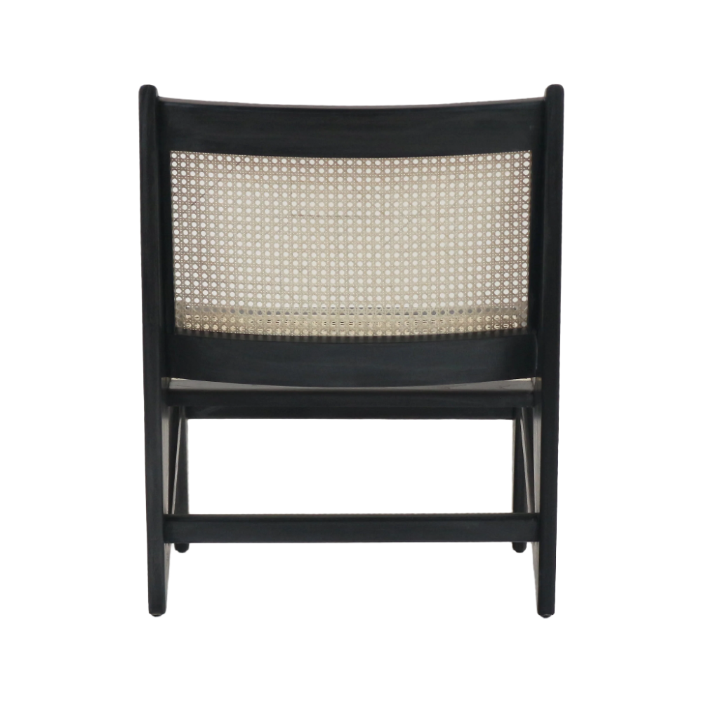 Rear view of a modern low lounge chair with a black-stained solid teak frame and a natural cane woven back panel, showing tapered legs and horizontal stretcher.