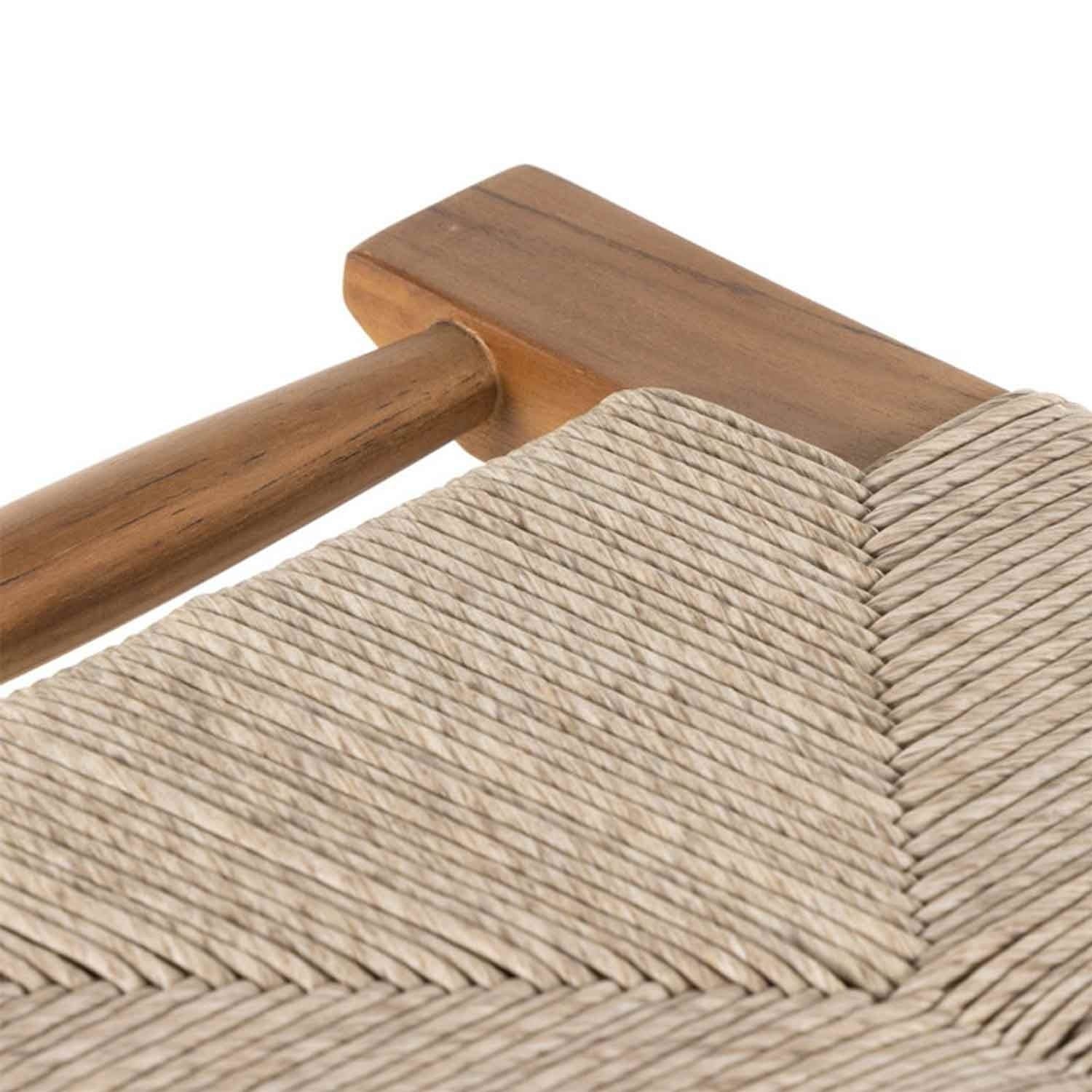 Close-up of a natural teak rail and tightly woven beige rope seat in a chevron pattern on a backless outdoor bar stool, highlighting wood grain and handwoven texture.