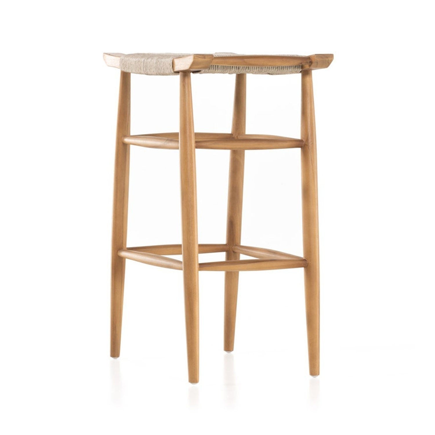 Backless teak bar stool in a natural finish with a woven seat, four tapered legs and integrated footrest — armless coastal-Scandinavian design for outdoor bar or counter use.