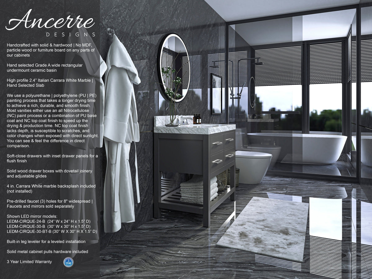 36-inch modern solid wood single-sink vanity in stone finish with white marble top, round LED mirror, three drawers and open lower shelf with towels and basket, shown in a dark marble bathroom with freestanding tub.