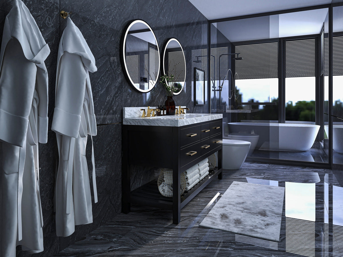 Modern freestanding 60-inch solid wood double-sink vanity with stone top and brass faucets, black base with open towel shelf, set in a dark stone bathroom with round mirrors, hanging robes and a freestanding tub.