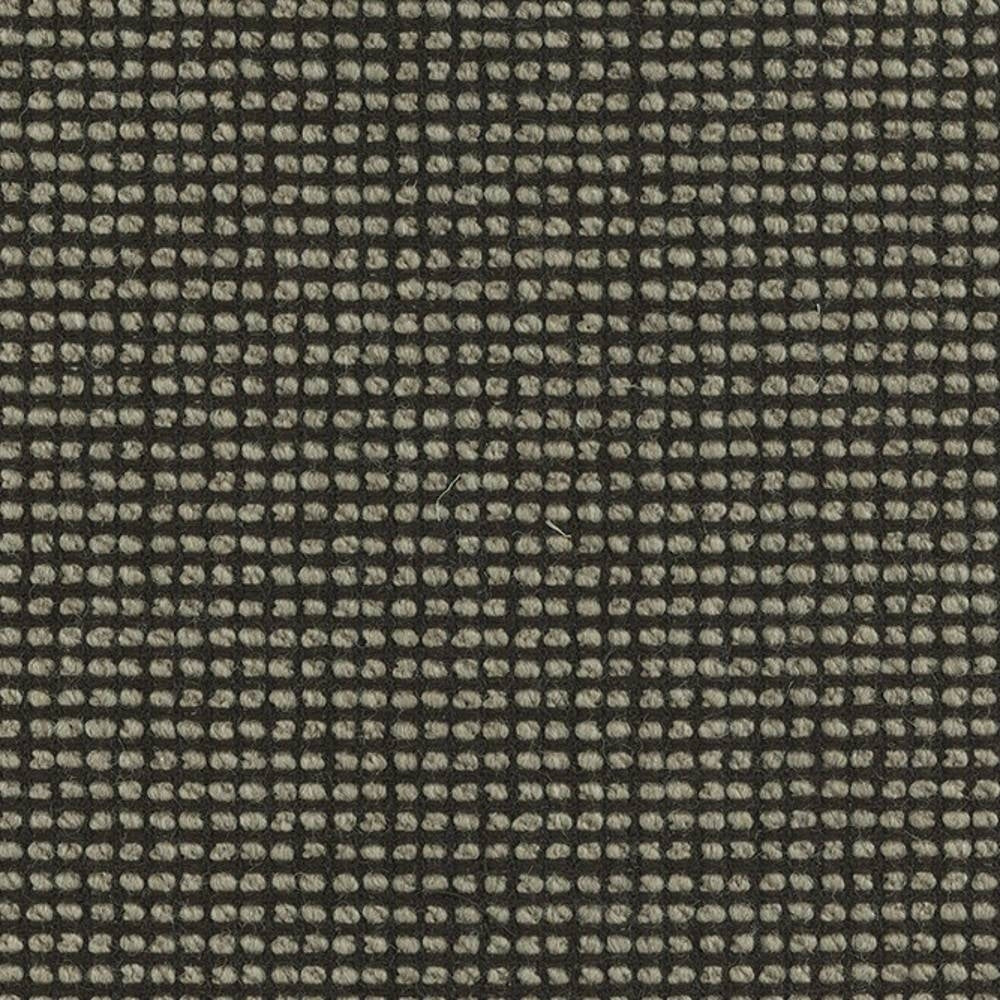 Close-up of a linen-wool blend upholstery fabric showing a small beige looped grid on a dark charcoal ground, highlighting textured yarn and a tight weave suitable for sofa upholstery.
