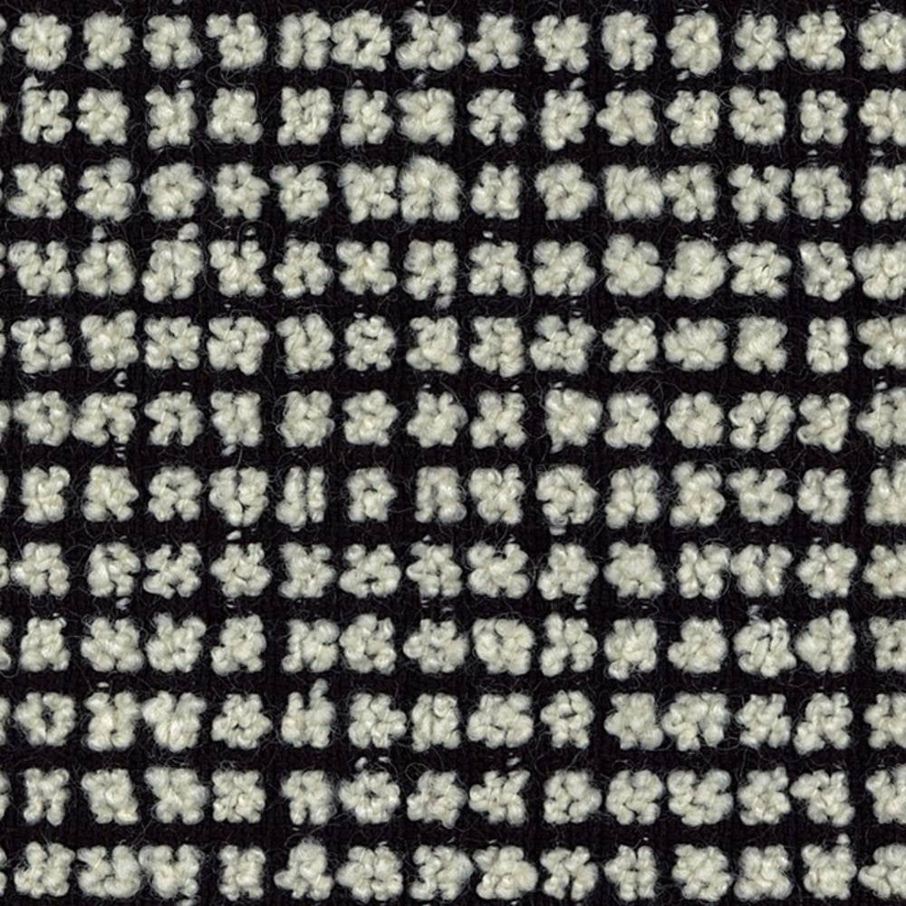Close-up of cream boucle upholstery fabric showing looped textured nubs in a tight black grid; wool-blend composition (25% wool, 40% acrylic, 35% polyester) suited for sofa upholstery.