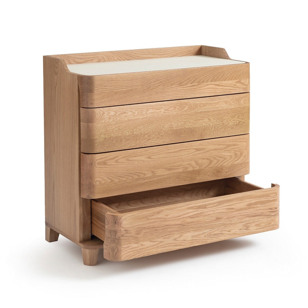 Contemporary blonde solid wood dresser with a white linoleum top, three rounded-front drawers and one lower drawer pulled open, showcasing light natural wood grain and short tapered legs.