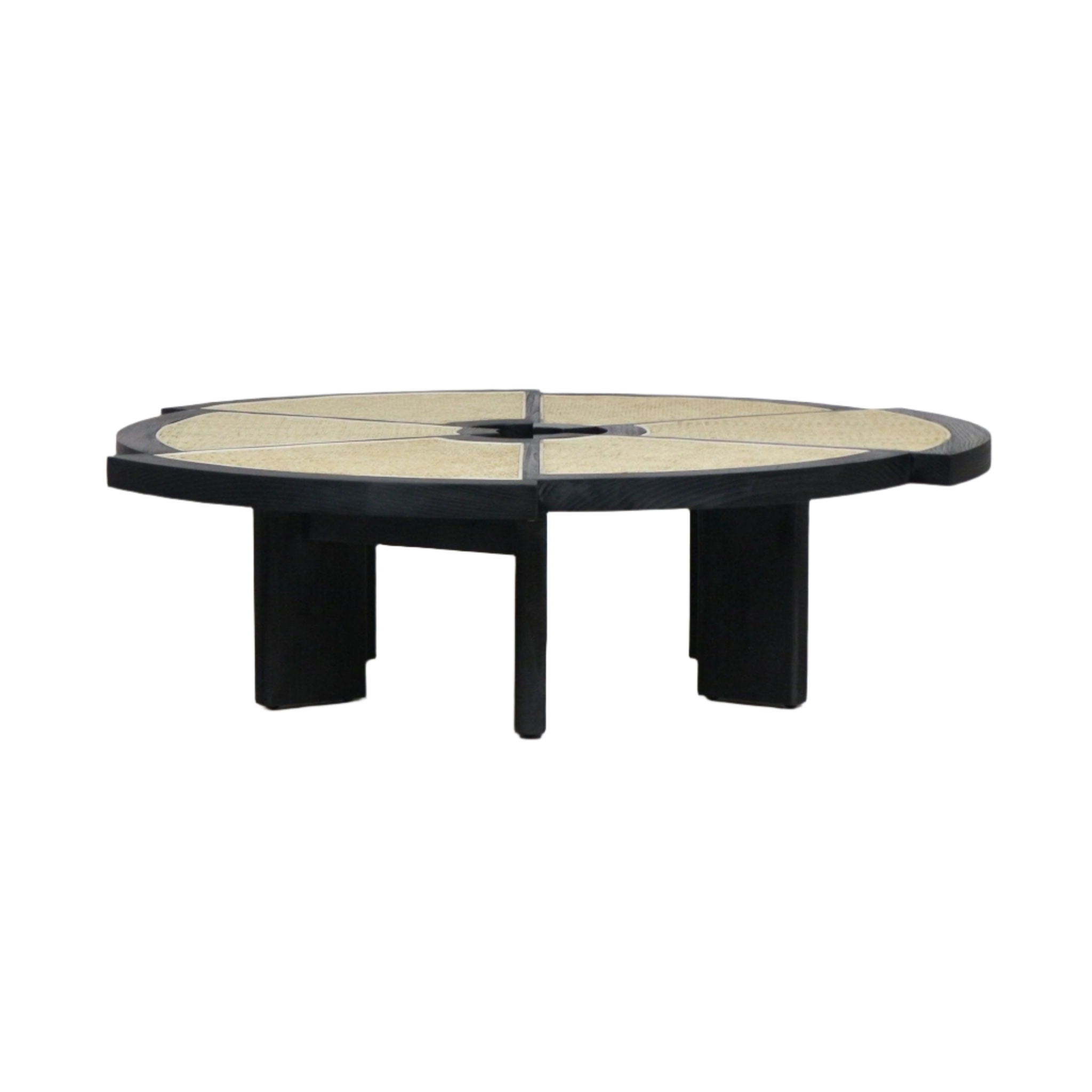 Low round coffee table with a black-stained wood frame and segmented natural cane top divided into wedge panels around a small center opening, supported by chunky black wooden legs for a modern midcentury look.