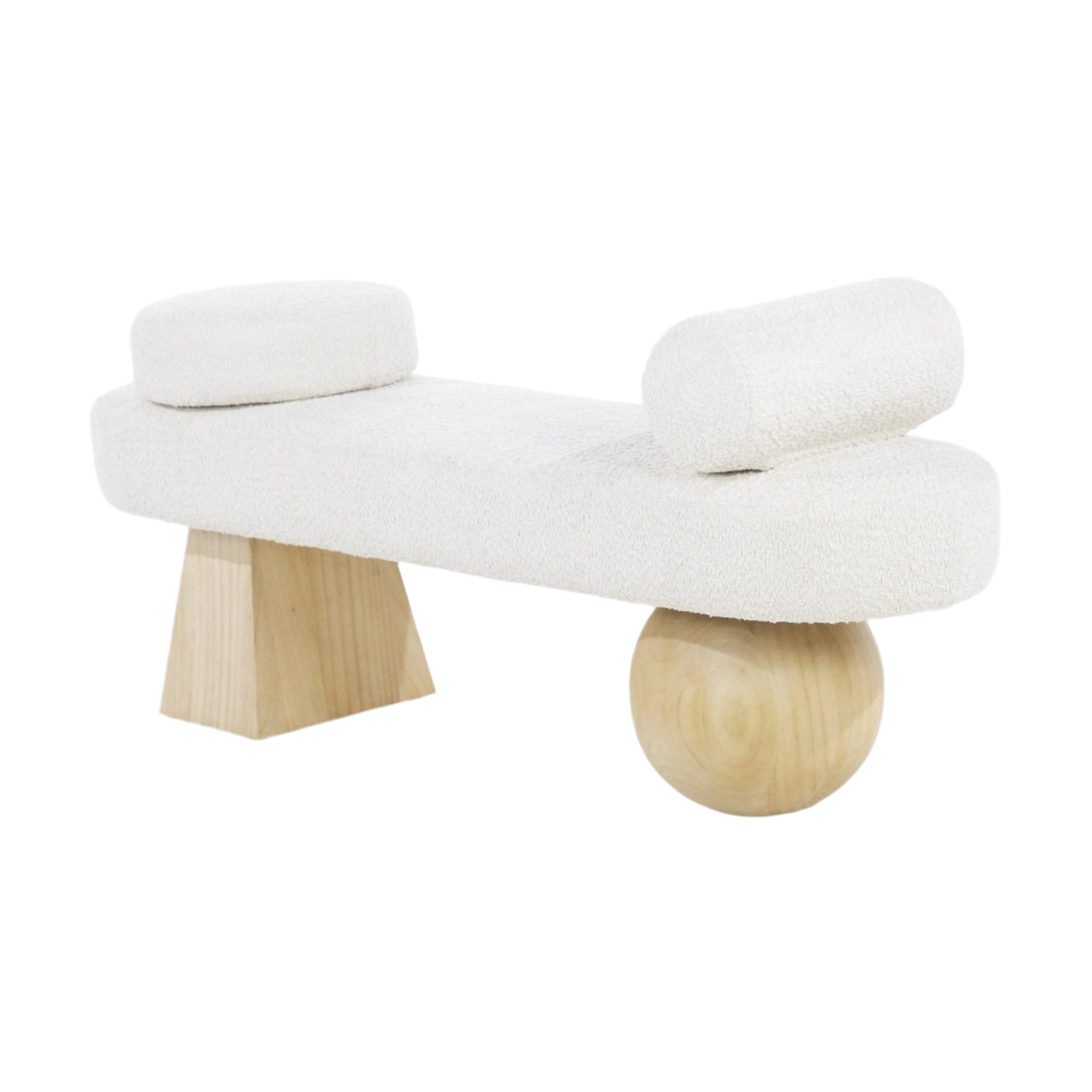 Cream boucle-upholstered bench with a low rectangular seat and two cylindrical bolster cushions, supported by sculptural natural solid wood legs — one geometric block and one round wood ball, contemporary coastal style.
