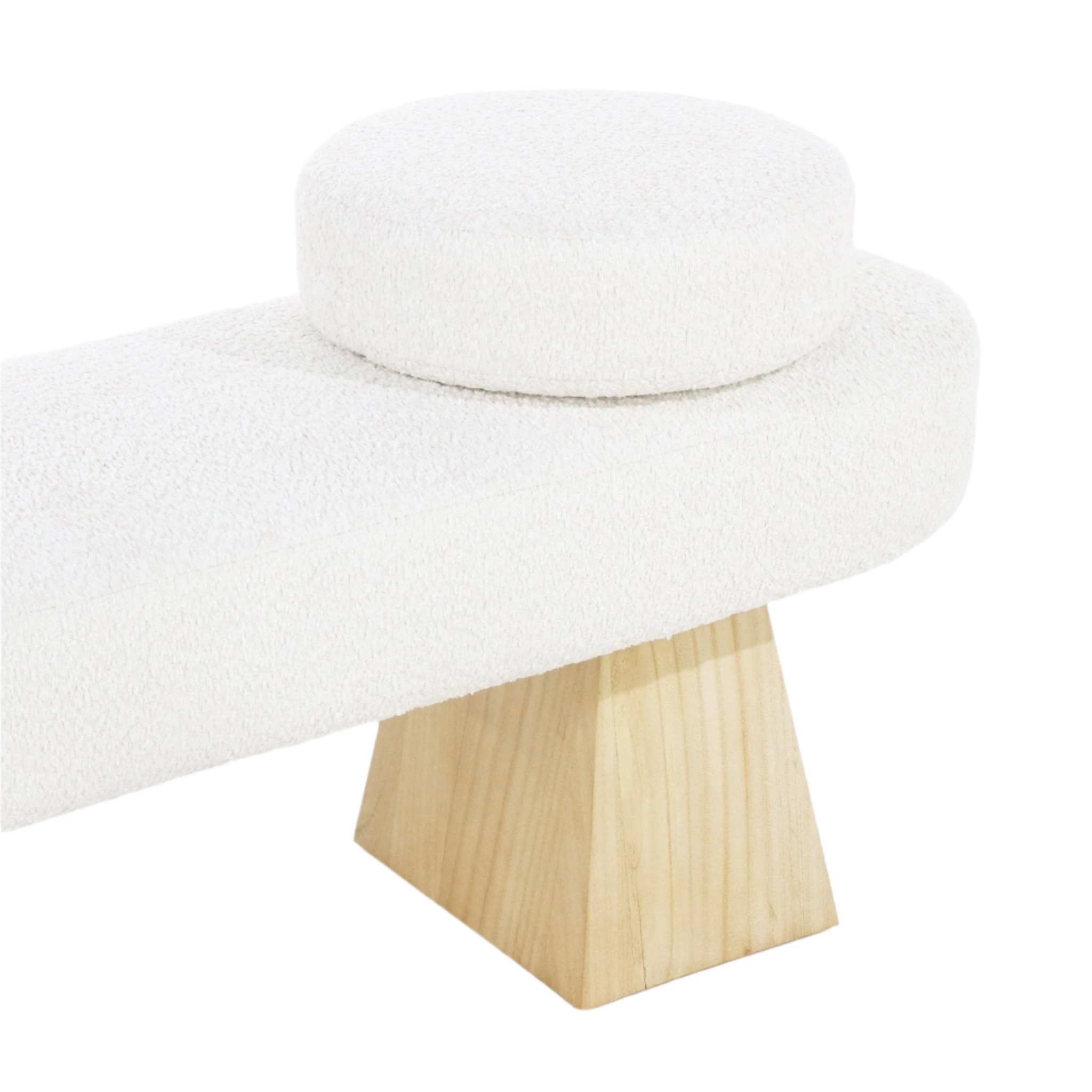 Close-up of a cream boucle-upholstered end-of-bed bench showing a round bolster cushion on the upholstered seat and a tapered light solid wood leg.