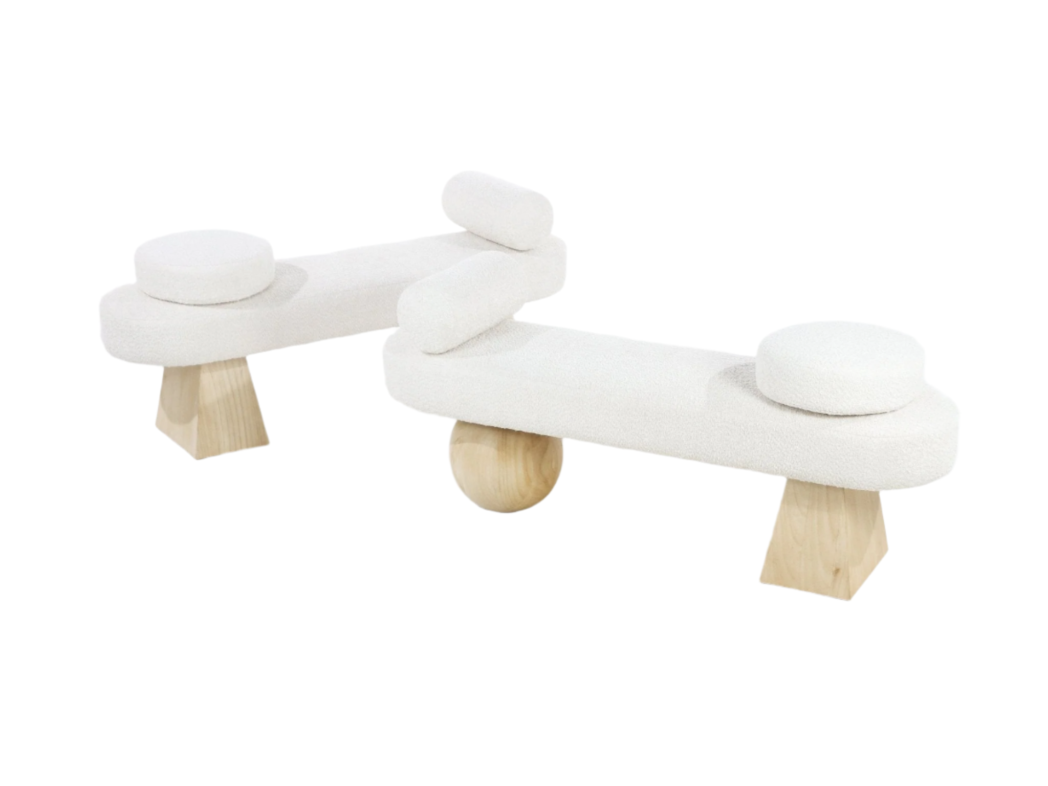 Two white boucle-upholstered benches with rounded rectangular seats, removable round seat pads and cylindrical bolsters, supported by natural light wood legs including tapered block feet and a central wooden sphere, on a white background.