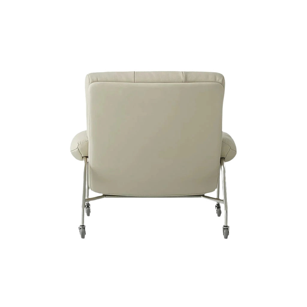 Rear view of a modern lounge chair upholstered in cream leather with a chrome steel frame and swivel casters, showing a squared padded back and rounded armrests.