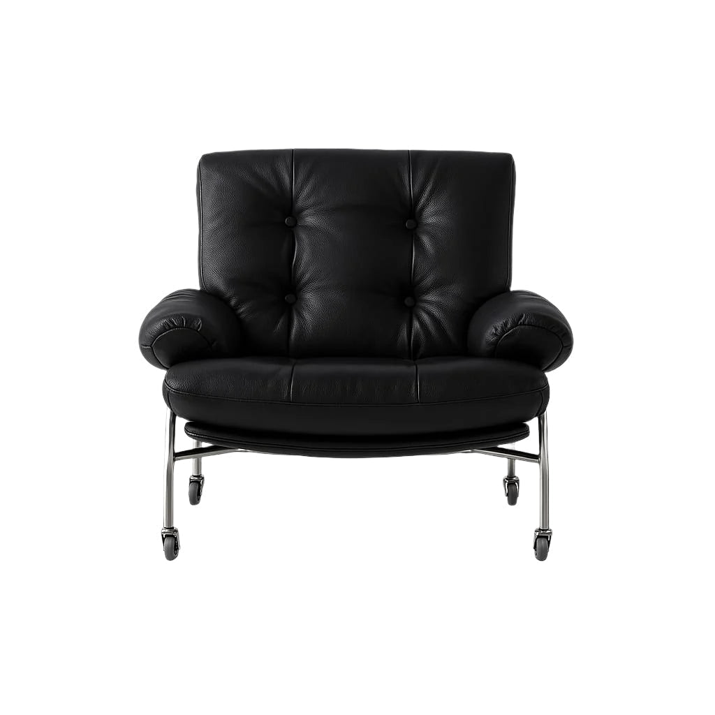 Front view of a modern black leather lounge chair with tufted back and button detailing, rolled arms, plush seat cushion and chrome steel frame supported on caster wheels.