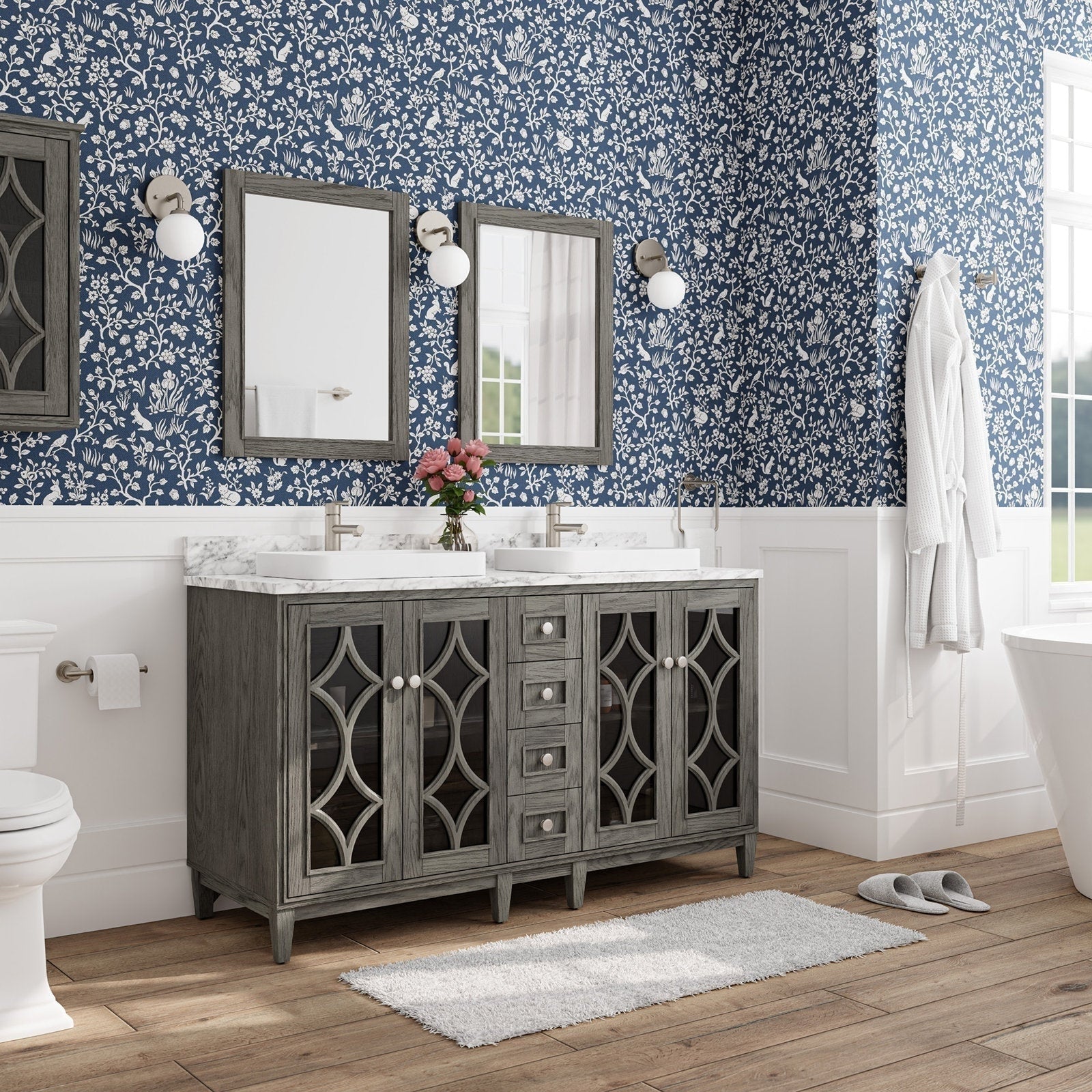 Modern freestanding solid-wood 60-inch double bathroom vanity with a stone marble top, two rectangular white vessel sinks and brushed-nickel faucets, gray decorative glass cabinet doors, wood-framed mirrors and globe sconces.