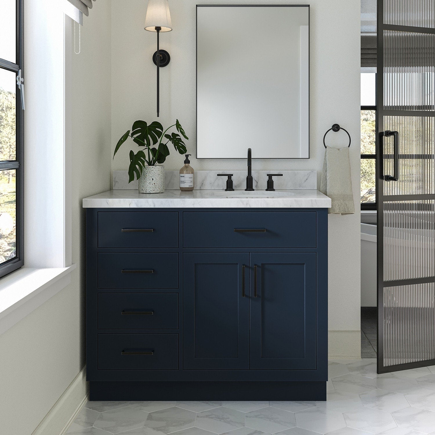 Modern 43-inch solid wood single-sink bathroom vanity with a stone marble top, deep navy painted base, matte black faucet and hardware, soft-close drawers and cabinet, mirror and potted plant on the countertop.