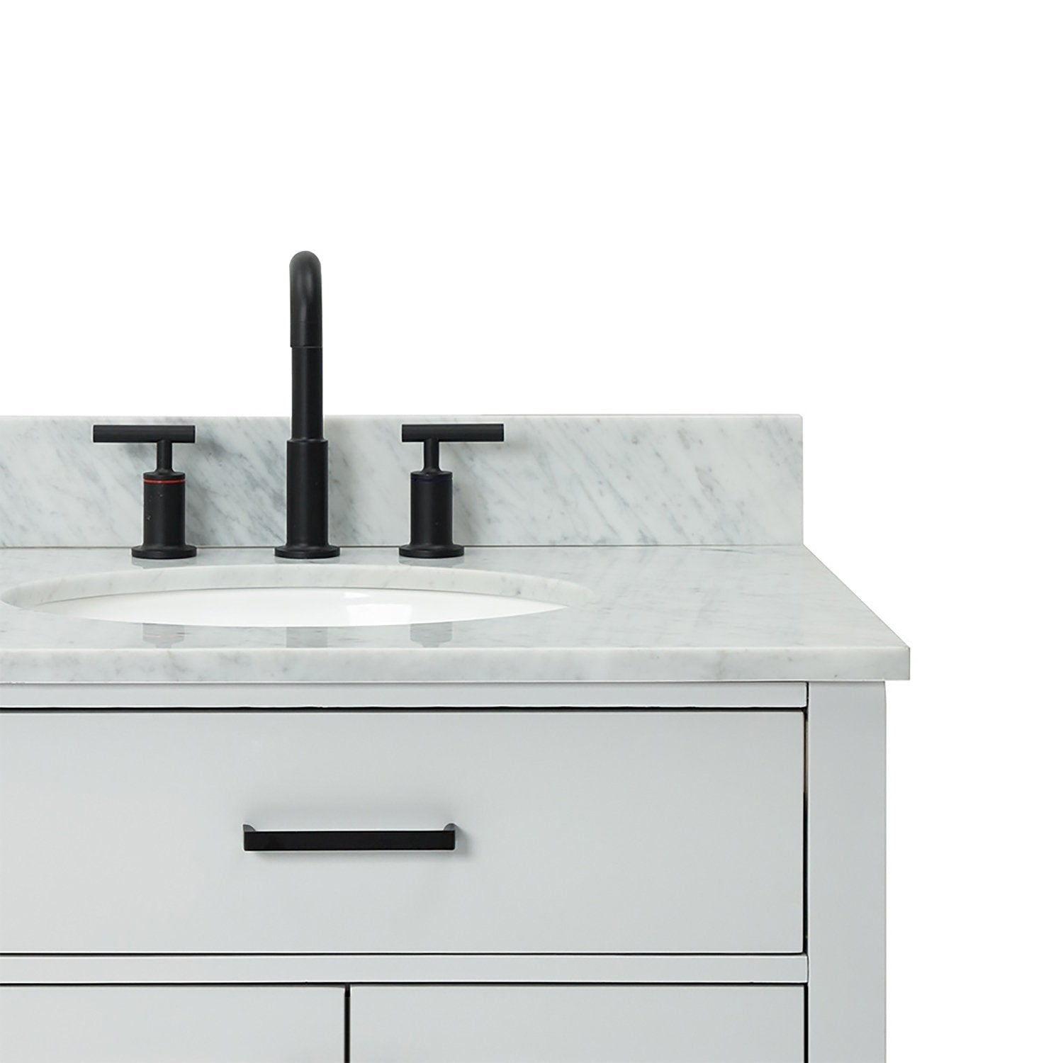 Close-up of a modern solid wood bathroom vanity with a white veined quartz countertop, oval undermount sink, matte black widespread faucet and matching black drawer handle.