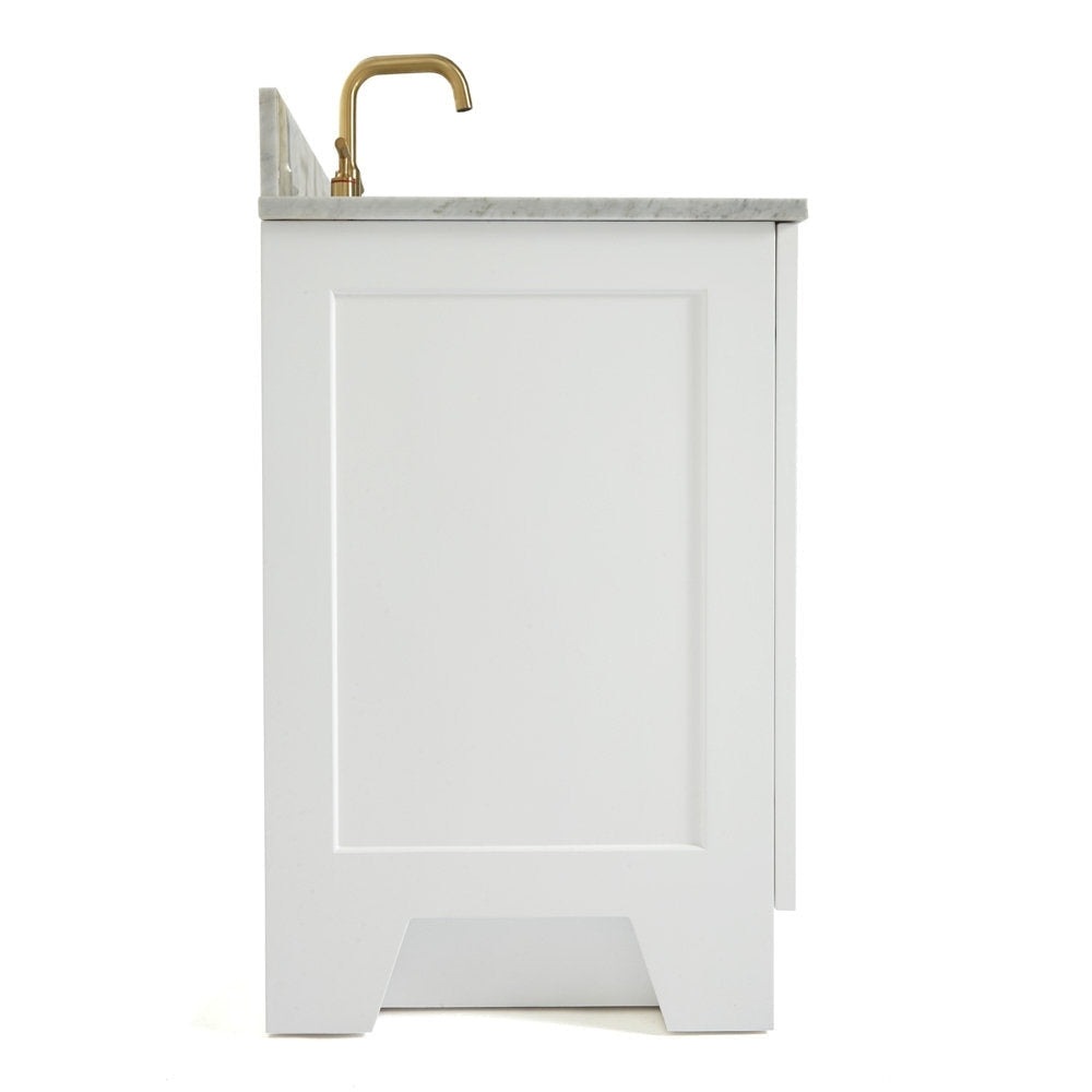 Side view of a white solid-wood bathroom vanity with a stone countertop, recessed panel door and satin-bronze faucet, shown in a clean modern freestanding design.