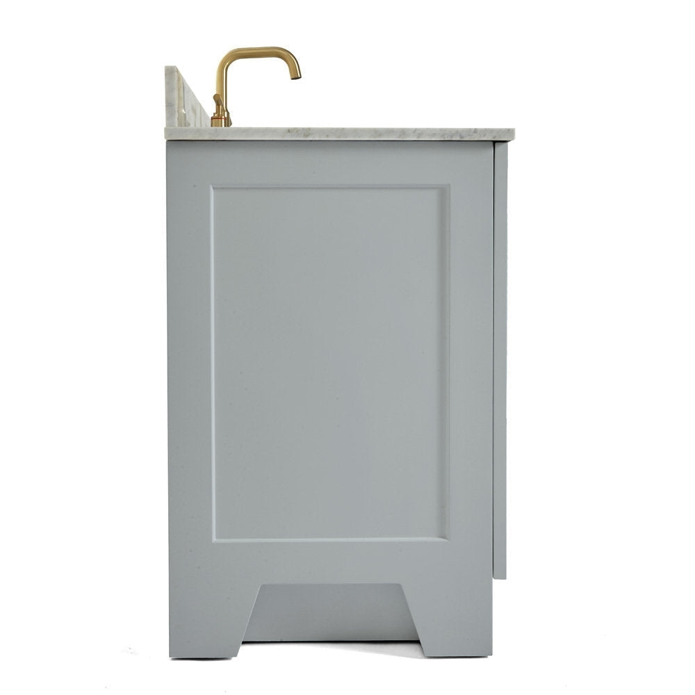 Side view of a gray solid wood single-sink bathroom vanity with a stone countertop and satin bronze faucet, showing recessed panel door and a cutout toe-kick in a modern contemporary style.