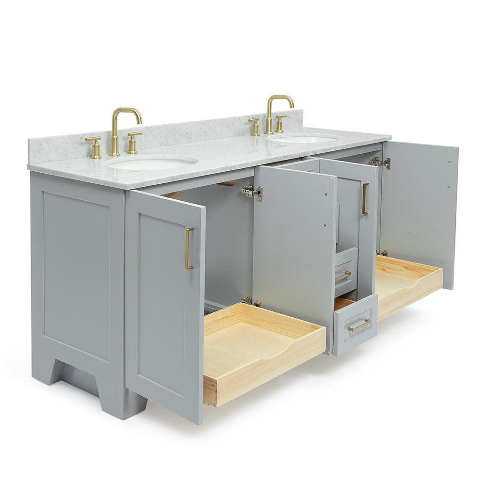 Angled view of a 73-inch modern gray solid wood bathroom vanity with white stone top, two undermount sinks, satin-bronze faucets and open natural-wood pull-out drawers revealing interior storage.