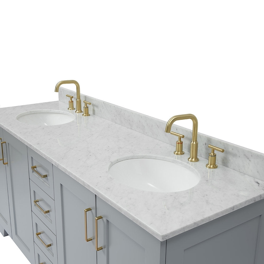 Gray solid wood bathroom vanity with a white marble stone countertop and backsplash, two white undermount sinks, satin bronze faucets and matching bronze handles.