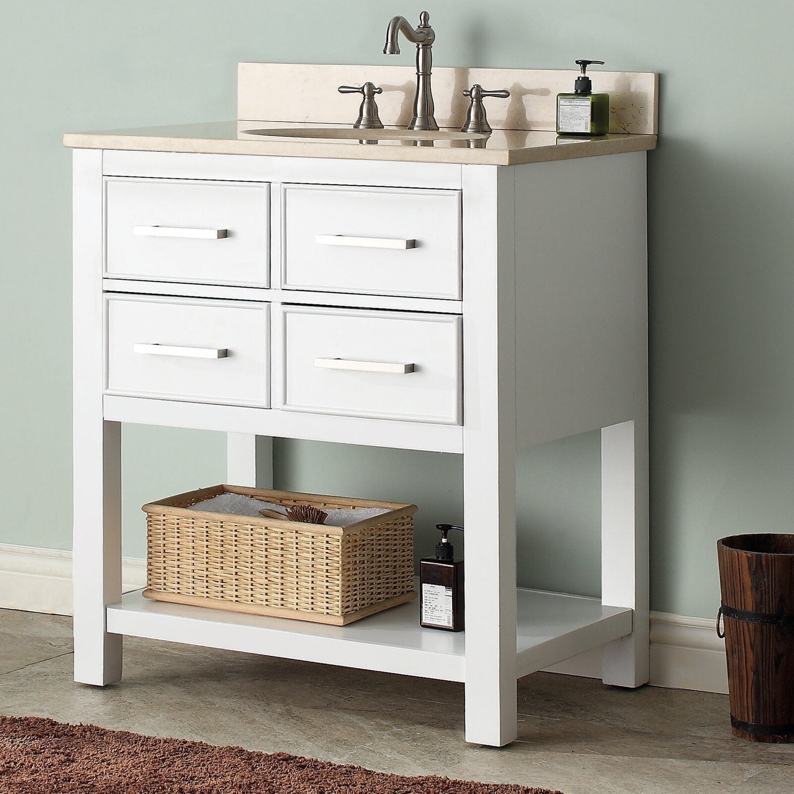31-inch modern solid wood bathroom vanity in stone color with beige stone countertop and undermount sink, brushed-nickel faucet, four drawer fronts and lower open shelf holding a wicker basket and soap dispenser.