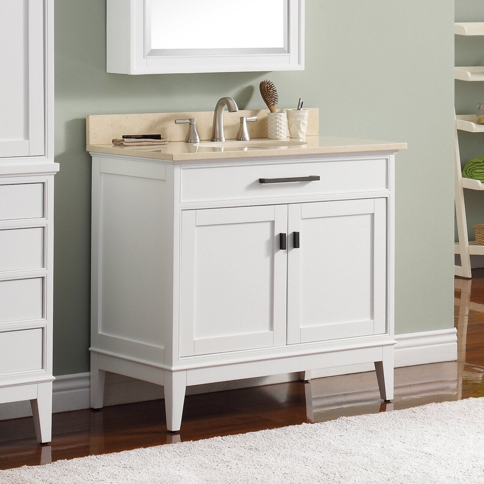 Freestanding modern white solid-wood bathroom vanity with a stone marble top, single integrated sink, brushed-nickel faucet, top drawer and two shaker-style cabinet doors with dark hardware.