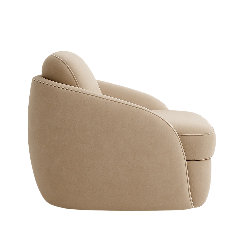Side profile of a modern beige fabric accent chair with a rounded, fully upholstered silhouette, low curved back, cushioned seat and subtle piped seams, shown on a white background.