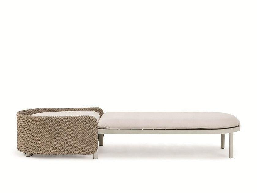 Coastal-style sun lounger with a rounded natural-tone rope-wrapped headrest and a beige outdoor-fabric cushion on a light metal frame with round legs.