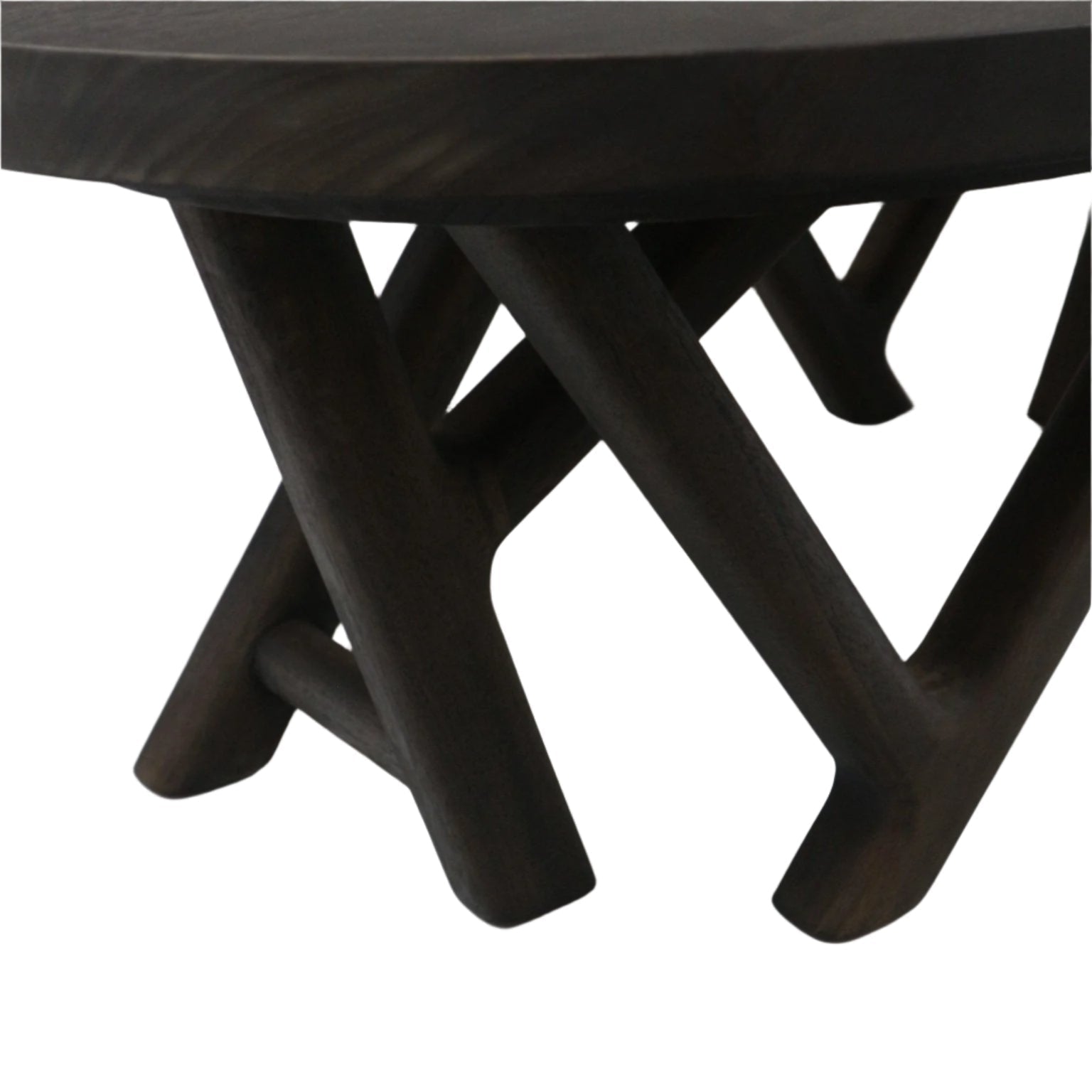 Close-up of a solid wood coffee table in mahogany smoked black showing intersecting rounded legs and the underside of the tabletop, highlighting the modern sculptural X-shaped base and dark wood grain.