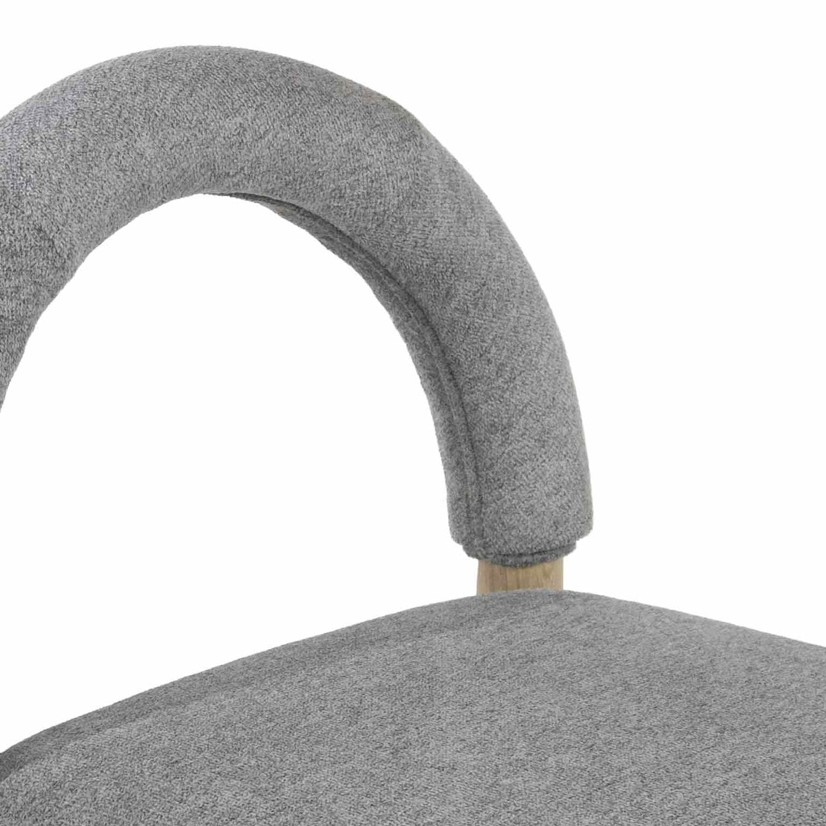 Close-up of a stool’s curved gray boucle upholstered backrest and matching seat top, showing textured boucle fabric and a natural oak frame detail.