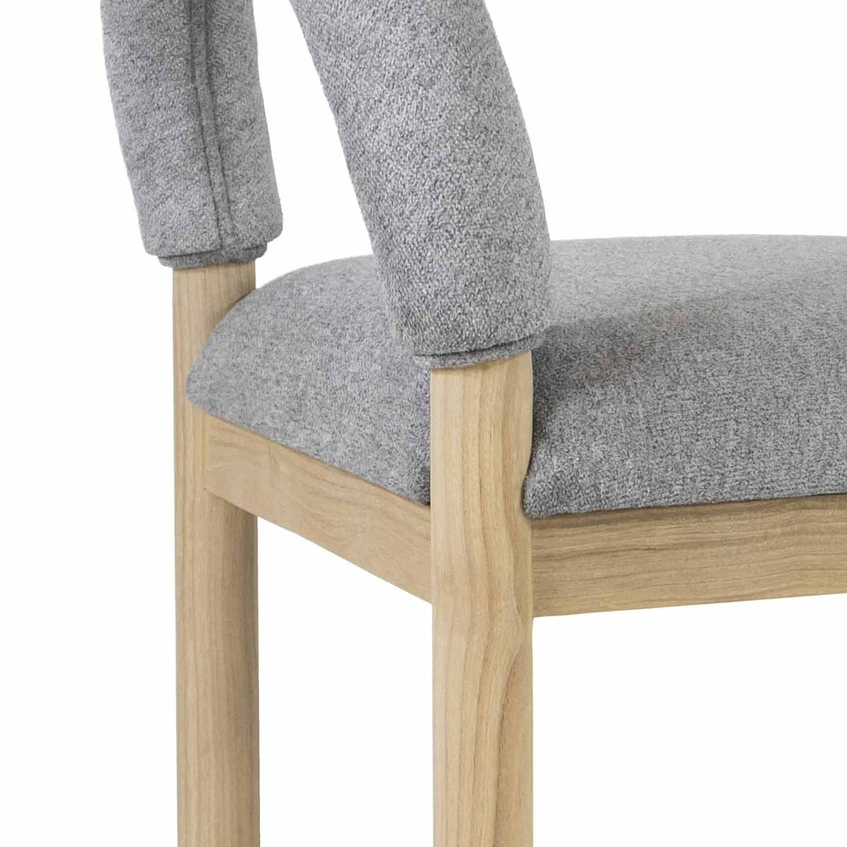 Close-up of a gray boucle upholstered seat and low back mounted on a natural oak frame and legs, highlighting the textured fabric and visible wood grain.