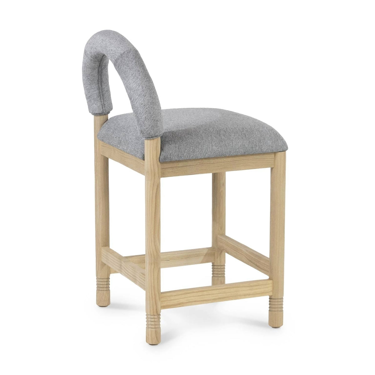 Natural oak framed counter stool with light gray bouclé upholstered seat and low curved backrest, square legs with cross stretchers and subtle turned details at the feet.