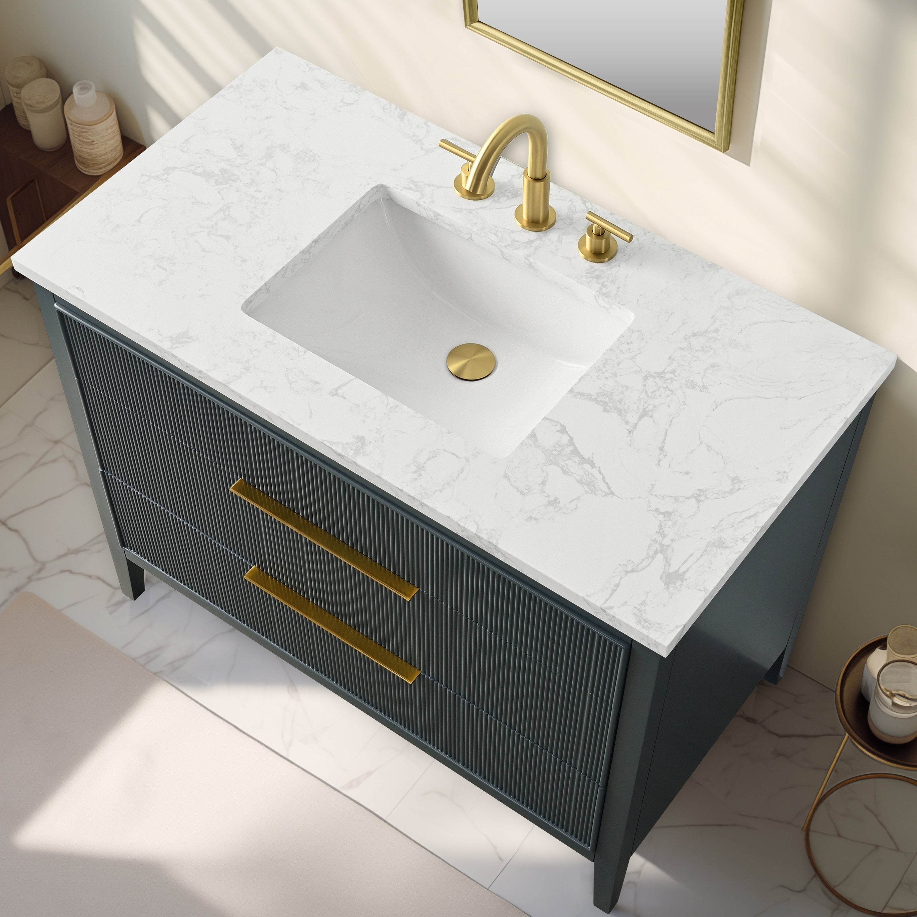 42-inch modern solid wood bathroom vanity with a white stone countertop and integrated rectangular ceramic sink, wooden fluted drawer fronts and brushed gold faucet, drain and long bar handles.
