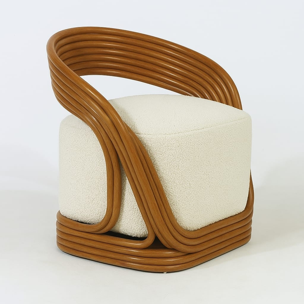 Modern accent chair with a looping natural cane frame in warm brown that wraps around a plush white fabric bouclé seat and squared base.