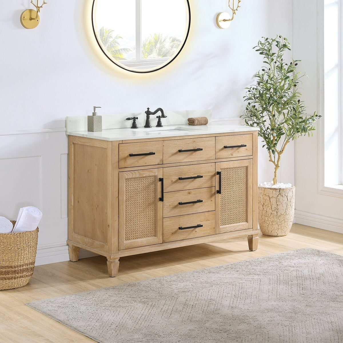 48-inch weathered fir single-sink bathroom vanity with Calacatta white quartz top, integrated white ceramic sink, black metal handles and faucet, and woven cane-front cabinet doors.