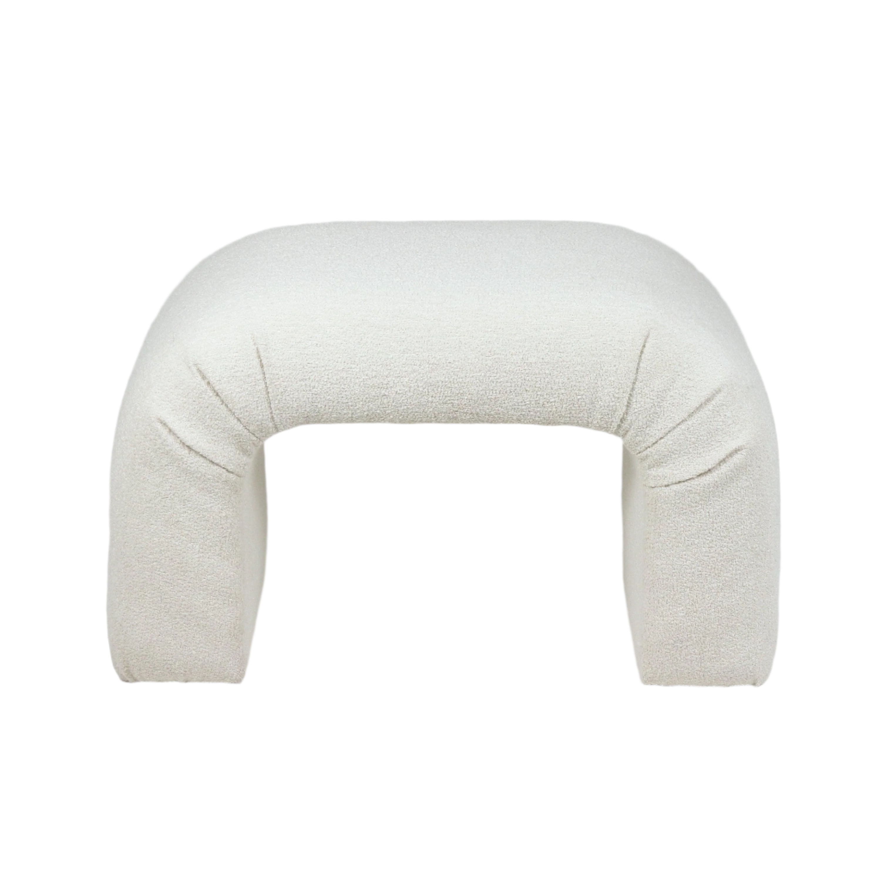 Backless cream boucle upholstered vanity stool with arched U-shaped form and soft textured fabric, shown against a white background.